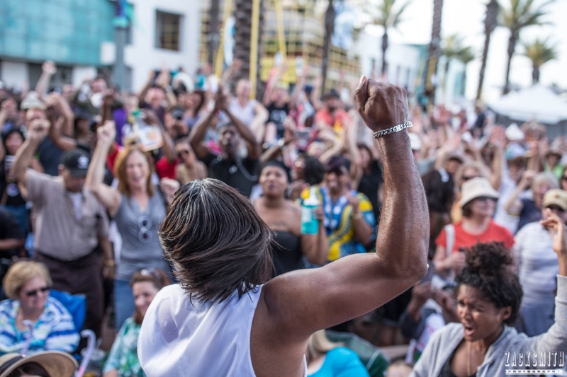 Big Chief Bo Dollis Jr. rallies the energetic crowd at the GE Capital Stage at the 2016 French Quarter Fest in New Orleans. ©Zack Smith